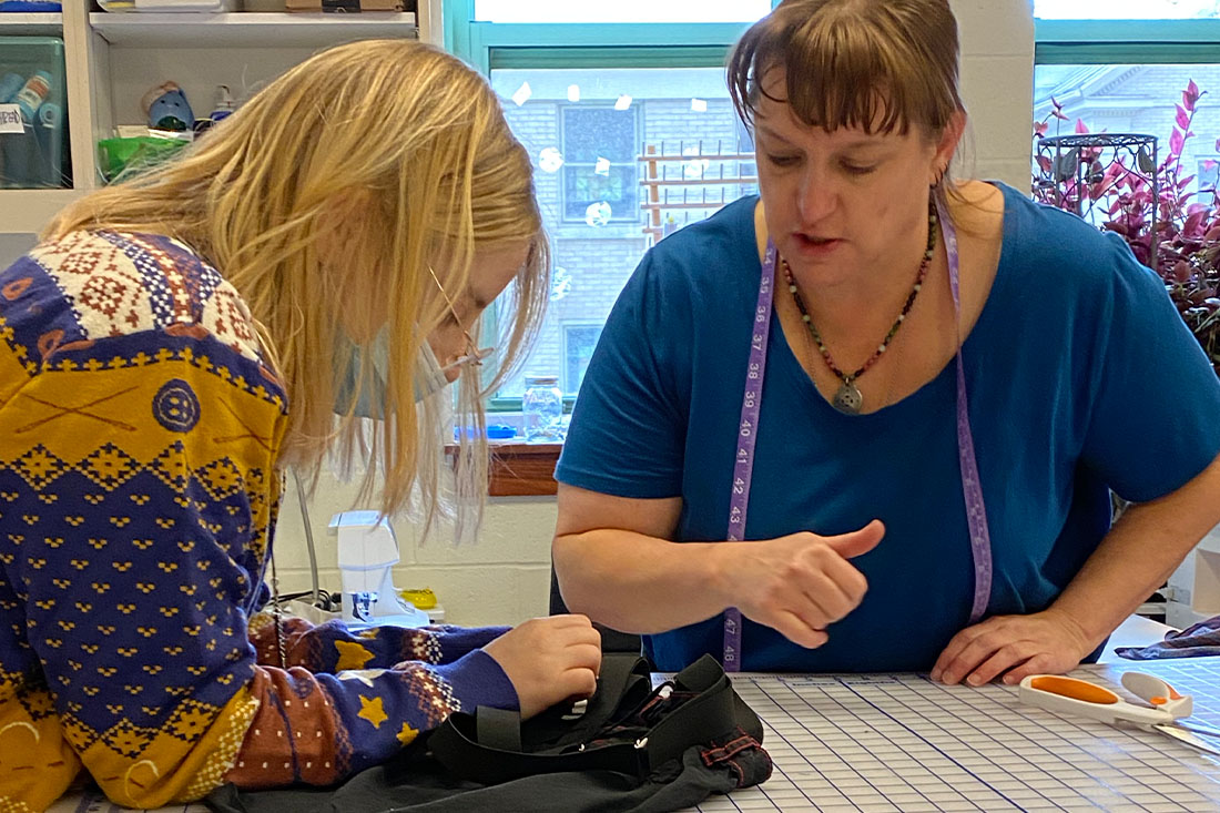 Photo of Professor Leibering with a Student in the Costume Shop